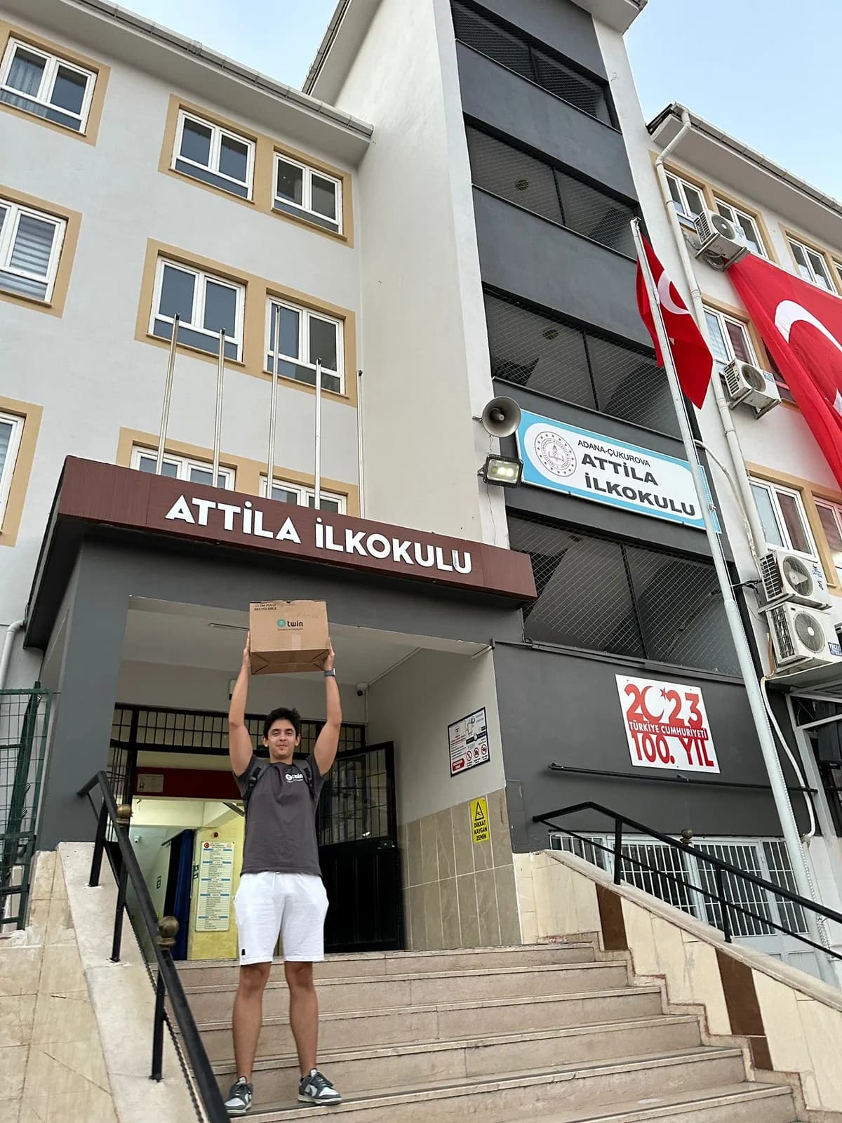 Carrying a Twin kit into Attila Primary School, Adana